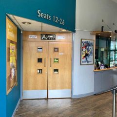 Auditorium entrance for seat numbers 1-11, next to the box office