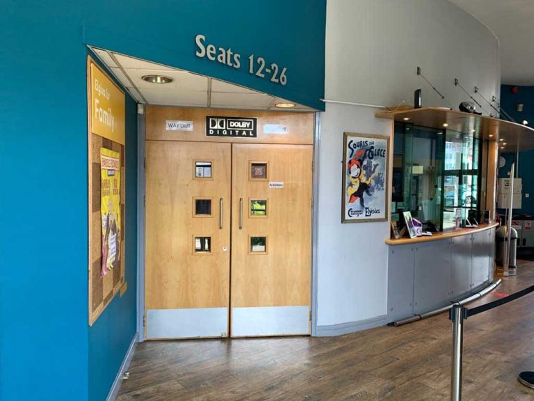 Auditorium entrance for seat numbers 1-11, next to the box office